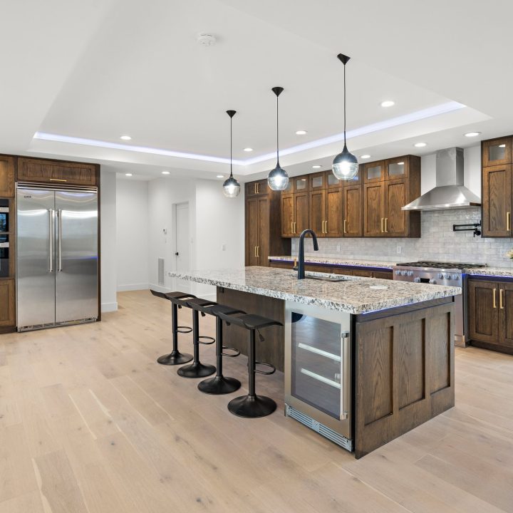 Interior of Livingston Residence, completed in 2024, showcasing custom kitchen cabinetry and a modern staircase design, located in Livingston, NJ.