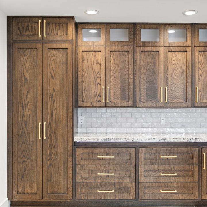 Interior of Livingston Residence, completed in 2024, showcasing custom kitchen cabinetry and a modern staircase design, located in Livingston, NJ.