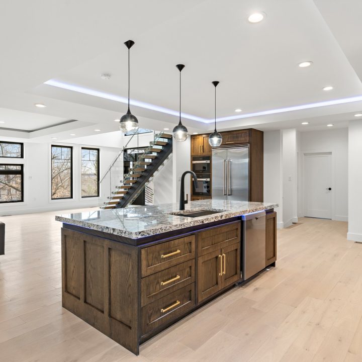 Interior of Livingston Residence, completed in 2024, showcasing custom kitchen cabinetry and a modern staircase design, located in Livingston, NJ.