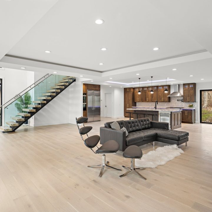 Interior of Livingston Residence, completed in 2024, showcasing custom kitchen cabinetry and a modern staircase design, located in Livingston, NJ.