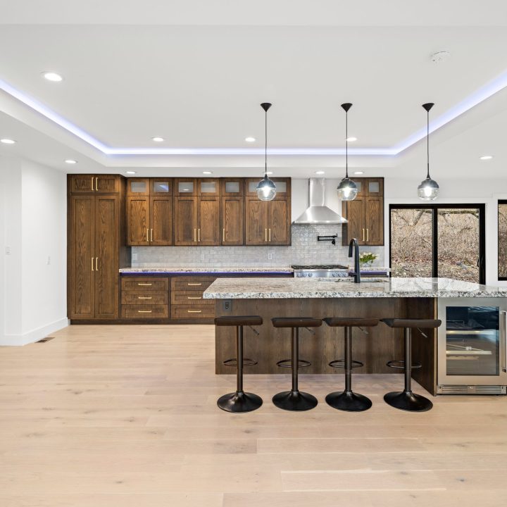 Interior of Livingston Residence, completed in 2024, showcasing custom kitchen cabinetry and a modern staircase design, located in Livingston, NJ.