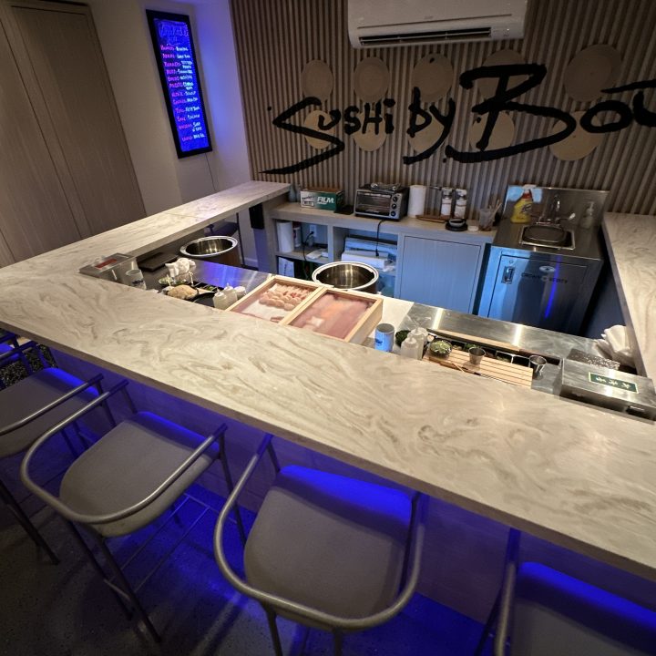 Interior of Sushi by Bou, completed in 2023, showcasing custom millwork including elegant wooden paneling and intricate details, located in Hoboken, NJ.