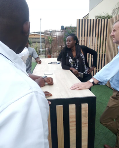 Outdoor mobile TV set for BBQ cooking show at TVC, Lagos, showcasing a TV stand crafted from plywood, with dis-mountable and mobile stage parts, covering a surface area of 40 sqm.