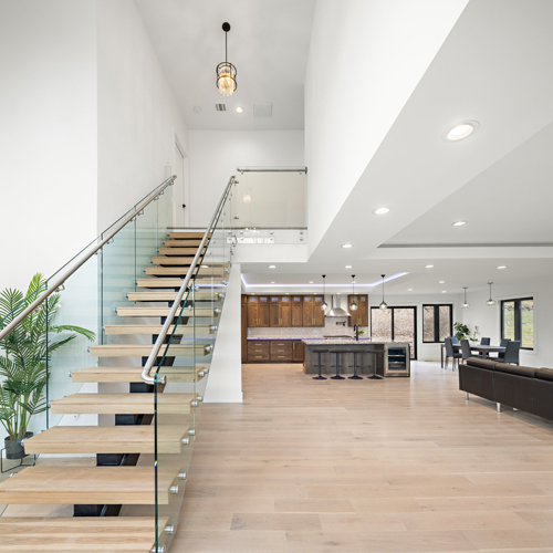 Interior of Livingston Residence, completed in 2024, showcasing custom kitchen cabinetry and a modern staircase design, located in Livingston, NJ.