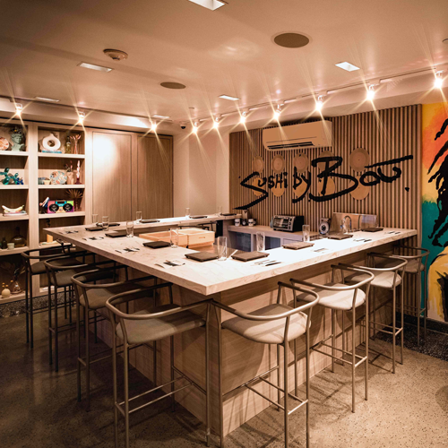 Interior of Sushi by Bou, completed in 2023, showcasing custom millwork including elegant wooden paneling and intricate details, located in Hoboken, NJ.