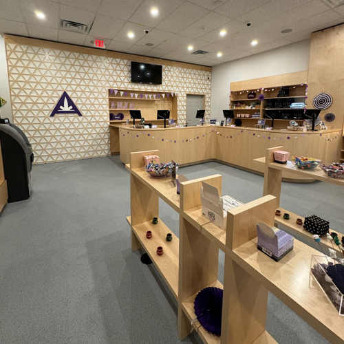 Interior of Anja Dispensary, completed in 2023, featuring custom millwork including modern wooden fixtures and intricate designs, located in Woodbridge, NJ.