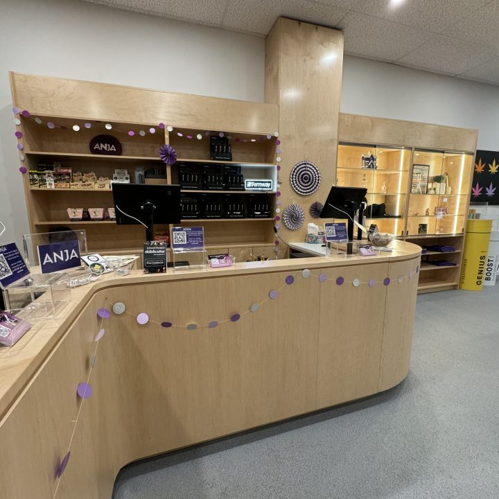 Interior of Anja Dispensary, completed in 2023, featuring custom millwork including modern wooden fixtures and intricate designs, located in Woodbridge, NJ.