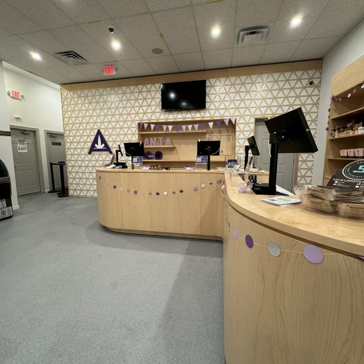 Interior of Anja Dispensary, completed in 2023, featuring custom millwork including modern wooden fixtures and intricate designs, located in Woodbridge, NJ.